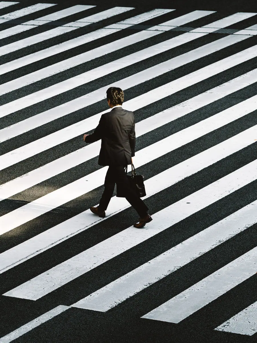 Business professionals crossing a street in the UAE
